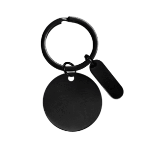 Image of a black circular keychain with charm